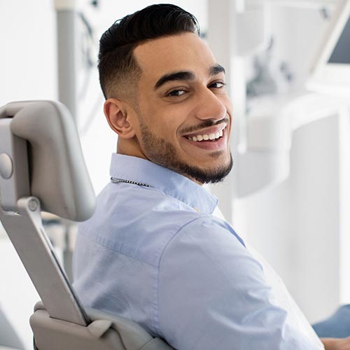 man-smiling-at-dentist man smiling at dentist