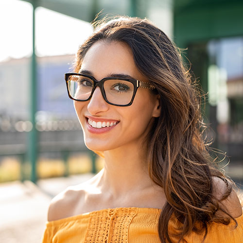 young-woman-big-smile-glasses young woman with big smile glasses